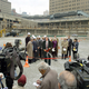 Onlookers tolerate the unveiling ceremony at Ground Zero.